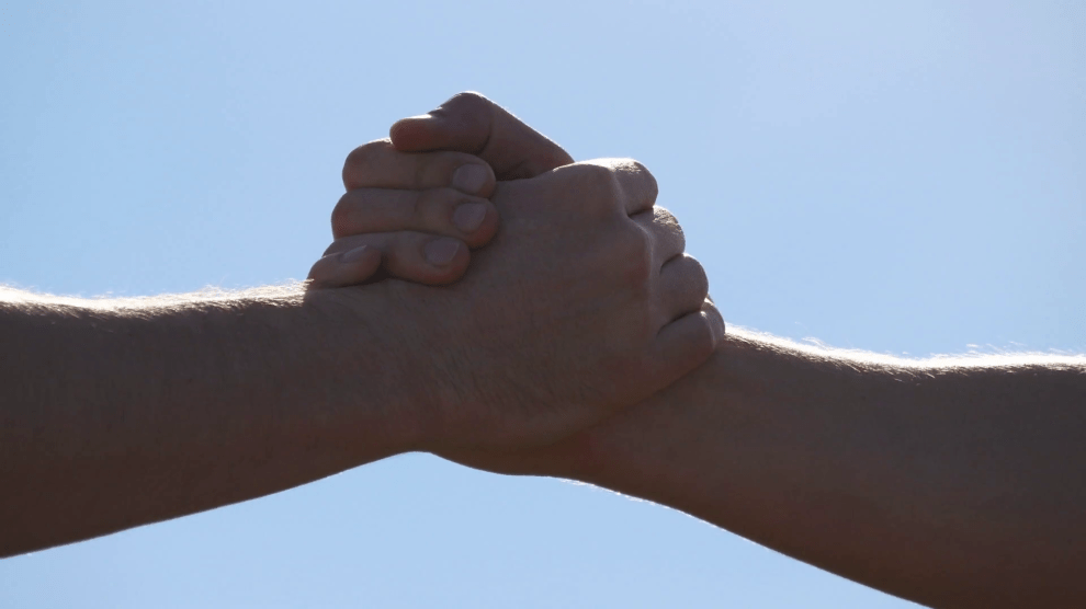 friendly-handshake-of-two-unrecognizable-muscular-white-men-on-blue-sky-background-shaking-of-male-arms-outdoor-two-strong-men-having-firm-handshake-outside-teamwork-and-friendship-close-up_s0ljsgi5p_thumbnail-